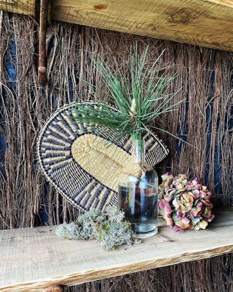 Styling foraged finds from a walk. Stilllife of dried flowers and a glass vase.