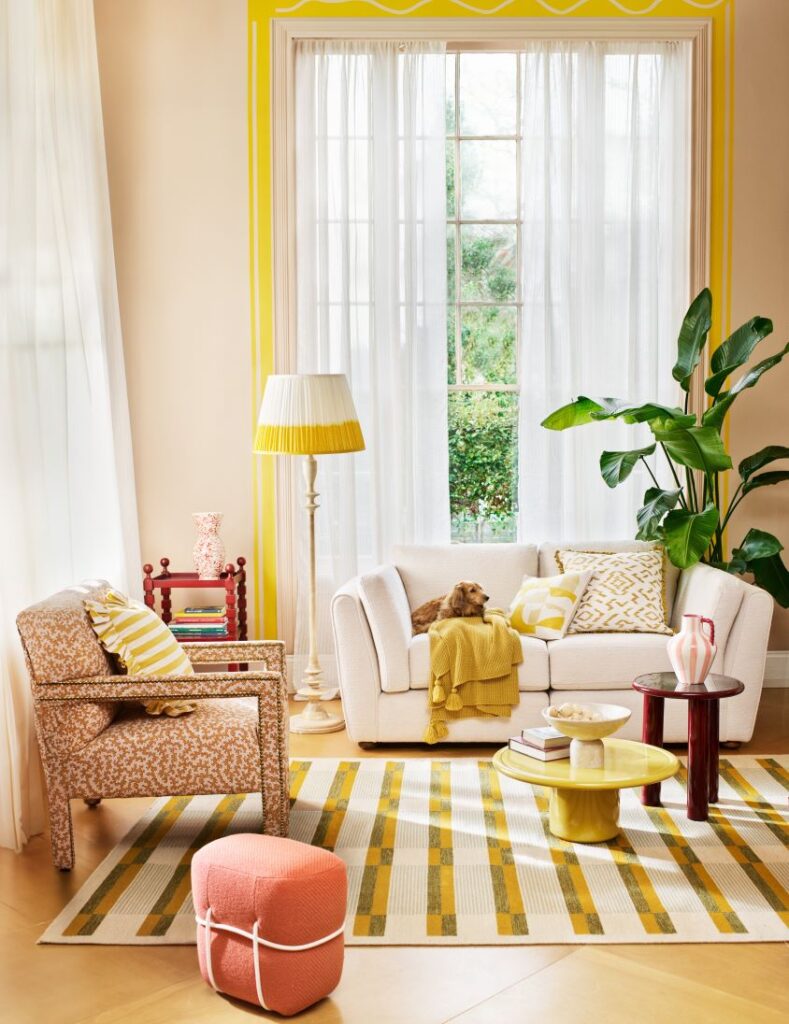 Yellow interiors Living room cream sofa