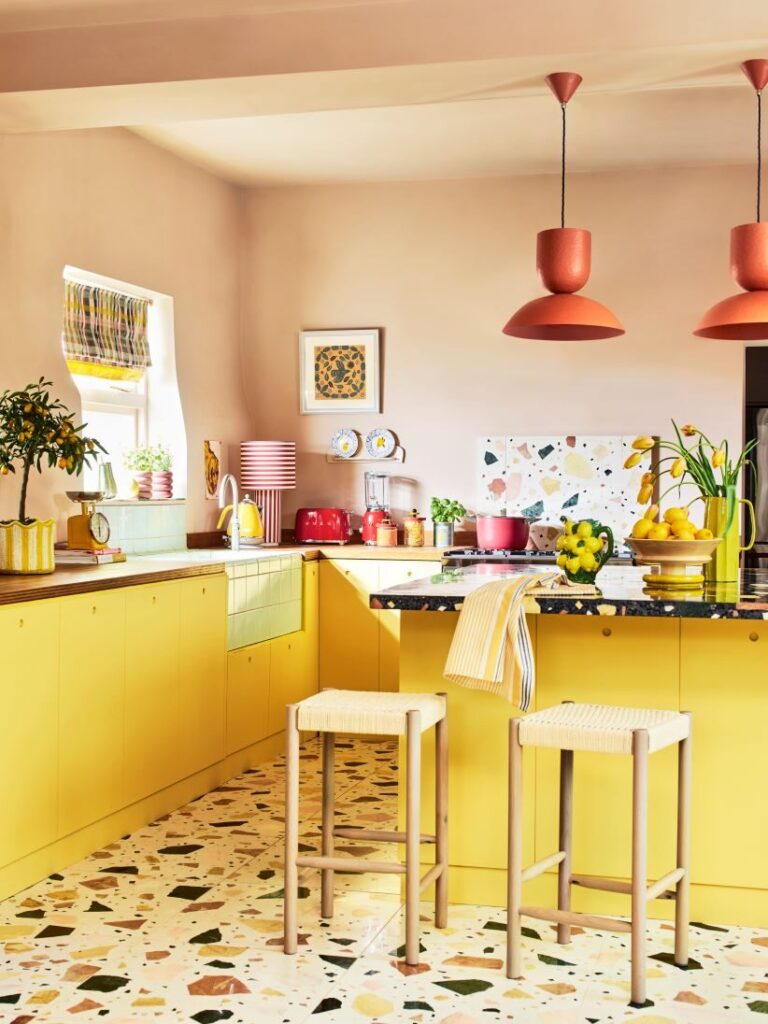 Yellow kitchen with stone floor