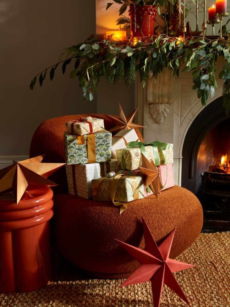 House beautiful  Christmas living room chair with presents detail